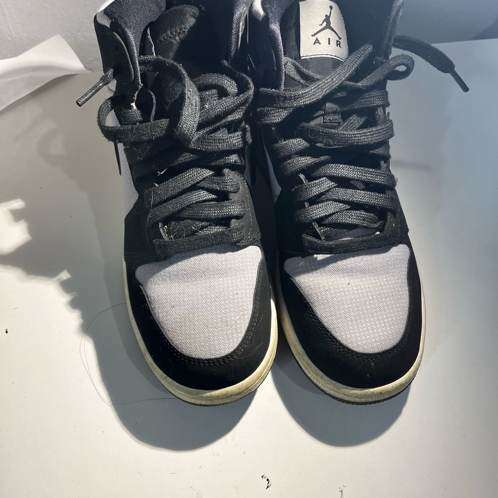 Black and grey Jordan mid